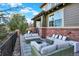 Spacious back patio with stylish outdoor furniture and fire pit at 10112 Bluffmont Ln, Lone Tree, CO 80124