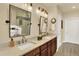 Bathroom featuring double vanity with framed mirrors and glass enclosed shower at 10112 Bluffmont Ln, Lone Tree, CO 80124