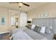 Bedroom featuring a sliding barn door leading to an ensuite bathroom at 10112 Bluffmont Ln, Lone Tree, CO 80124