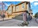 Charming townhome exterior with attached garages and landscaped front yard at 10112 Bluffmont Ln, Lone Tree, CO 80124