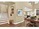 Inviting interior featuring a staircase, an alcove, and an open view of the dining area at 10112 Bluffmont Ln, Lone Tree, CO 80124