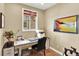 Inviting home office space with a comfortable workspace and natural light streaming through the window at 10112 Bluffmont Ln, Lone Tree, CO 80124