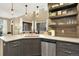Kitchen boasts stainless steel appliances, light countertops, and an open floorplan at 10112 Bluffmont Ln, Lone Tree, CO 80124