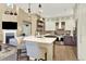 Bright kitchen features island with seating, stainless steel appliances, and an open floorplan at 10112 Bluffmont Ln, Lone Tree, CO 80124