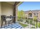 Relax on the balcony with peaceful views of the community and manicured landscape at 15362 W 66Th Ave # D, Arvada, CO 80007