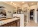 The bathroom features a walk-in shower, and dual sink vanity with ample storage at 15362 W 66Th Ave # D, Arvada, CO 80007