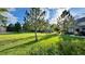 Beautiful community green space featuring mature trees and lush lawns, creating a peaceful and inviting atmosphere for residents at 15362 W 66Th Ave # D, Arvada, CO 80007
