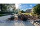 Enjoy a serene community park with picnic benches, rose bushes, and lush greenery for relaxation and outdoor enjoyment at 15362 W 66Th Ave # D, Arvada, CO 80007