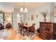 Formal dining room features hardwood floors, elegant lighting, and easy access to other living spaces at 15362 W 66Th Ave # D, Arvada, CO 80007