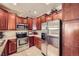 Kitchen features stainless appliances, granite counters, and tile flooring at 15362 W 66Th Ave # D, Arvada, CO 80007