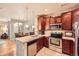 Well-equipped kitchen with stainless steel appliances and granite countertops at 15362 W 66Th Ave # D, Arvada, CO 80007