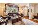 Inviting living room featuring a plush sofa, window, and neutral color palette at 15362 W 66Th Ave # D, Arvada, CO 80007