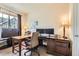 This home office is perfect for remote work with its large windows and ample sunlight at 15362 W 66Th Ave # D, Arvada, CO 80007