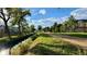 Scenic walking path with mature trees and landscaping at 15362 W 66Th Ave # D, Arvada, CO 80007