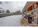 Large backyard with a covered patio, perfect for outdoor gatherings and enjoying the scenic surroundings at 306 S Newport Way, Denver, CO 80224