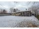 Expansive backyard with a covered patio area, offering ample space for outdoor activities and relaxation at 306 S Newport Way, Denver, CO 80224