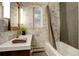 Stylish bathroom featuring white countertops and unique gray tiled walk-in shower at 306 S Newport Way, Denver, CO 80224