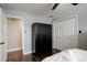 Bedroom with hardwood floors and a large wardrobe closet to maximize storage space at 306 S Newport Way, Denver, CO 80224