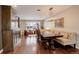 Elegant dining area featuring a stylish light fixture and comfortable bench seating at 306 S Newport Way, Denver, CO 80224