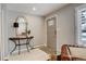 Inviting home entryway featuring neutral colors and a stylish mirror at 306 S Newport Way, Denver, CO 80224