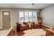 Cozy living room featuring a large window, hardwood floors, and comfortable seating at 306 S Newport Way, Denver, CO 80224