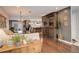 Open concept living room featuring hardwood floors, a dining area and modern decor at 306 S Newport Way, Denver, CO 80224