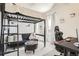 Stylish bedroom featuring a lofted bed, black futon, and a decorative patterned accent wall at 2572 Iola St, Aurora, CO 80010