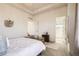 Cozy bedroom featuring a tray ceiling, with ensuite bathroom access, and soft natural light, and classic style at 2572 Iola St, Aurora, CO 80010