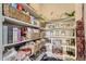 Well-stocked pantry featuring ample shelving filled with a variety of food items and storage baskets at 2572 Iola St, Aurora, CO 80010