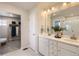 Double vanity bathroom with walk-in shower and linen closet at 42774 Calusa Pines Rd, Elizabeth, CO 80107