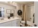 Clean bathroom with double vanity and tub shower combo at 42774 Calusa Pines Rd, Elizabeth, CO 80107