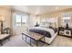 Spacious main bedroom with plush bedding and large windows at 42774 Calusa Pines Rd, Elizabeth, CO 80107