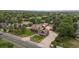 An aerial view of an extravagant home showcasing its generous lot and surrounding lush greenery at 11485 Pecos St, Denver, CO 80234