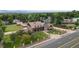 Spacious home with detailed turret and extensive grounds, situated amongst lush trees at 11485 Pecos St, Denver, CO 80234