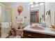 Charming bathroom with pink sink, tiled shower, and vintage decor accents for a cozy feel at 11485 Pecos St, Denver, CO 80234