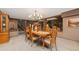 Elegant dining room with wooden table set, chandelier, and classic decor, ideal for Gathering meals at 11485 Pecos St, Denver, CO 80234