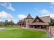 Majestic home featuring unique architectural details and sprawling green landscape at 11485 Pecos St, Denver, CO 80234