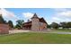 Charming home boasts a unique turret feature, balcony, and well-manicured lawn at 11485 Pecos St, Denver, CO 80234