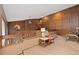 This hall features wainscotting, a brick accent wall, and a view to the outside at 11485 Pecos St, Denver, CO 80234
