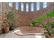 Unique indoor hot tub with stone walls and arched windows, creating a serene spa-like atmosphere at 11485 Pecos St, Denver, CO 80234