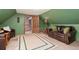 This upstairs bonus room features a comfortable leather sofa and access to other living spaces at 11485 Pecos St, Denver, CO 80234