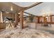 Elegant living space showcasing marble floors, brick pillars, and classic decor at 11485 Pecos St, Denver, CO 80234