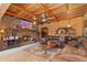Cozy living room with brick fireplace, wood ceiling beams, and plush leather sofa for relaxation at 11485 Pecos St, Denver, CO 80234