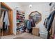 This walk-in closet features a lot of useful storage, shelving, hanging space, and an octagonal window at 11485 Pecos St, Denver, CO 80234