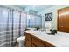 Cozy bathroom featuring a shower-tub combo with modern fixtures and vanity at 2136 S Scranton Way, Aurora, CO 80014