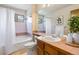 Classic bathroom with a tub/shower combo and vanity with a tile countertop at 2136 S Scranton Way, Aurora, CO 80014