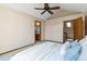 Bedroom featuring neutral walls, a ceiling fan, and an ensuite bathroom visible through the open door at 2136 S Scranton Way, Aurora, CO 80014