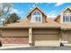 Charming home with a two-car garage and well-maintained exterior, enhanced by brick and siding accents at 2136 S Scranton Way, Aurora, CO 80014