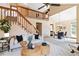 Open floor plan showcasing a living room, dining area, and staircase at 2136 S Scranton Way, Aurora, CO 80014