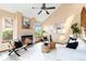 Bright living room with a cozy fireplace, vaulted ceilings, and modern decor at 2136 S Scranton Way, Aurora, CO 80014